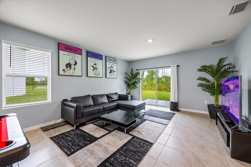1680 Hazy Sea Drive Plant City, FL 33565 - Photo 10 of 49 a living room with furniture rug and window