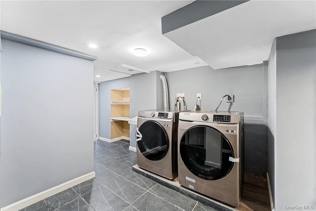 58 Whippoorwill Road East Armonk, NY 10504 - Photo 13 of 20 a utility room with dryer and washer