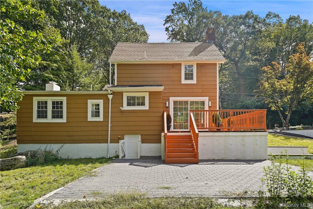 58 Whippoorwill Road East Armonk, NY 10504 - Photo 16 of 20 a view of a house with a patio
