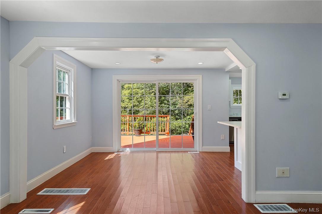 58 Whippoorwill Road East Armonk, NY 10504 - Photo 4 of 20 a view of an empty room with wooden floor and a window