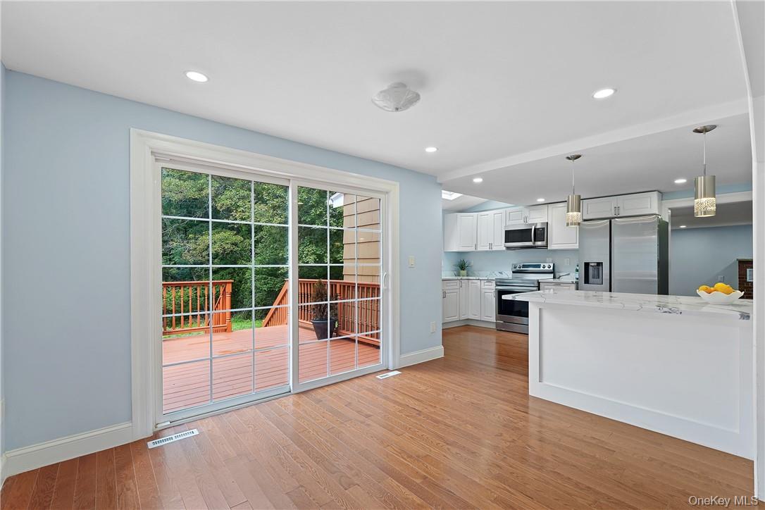 58 Whippoorwill Road East Armonk, NY 10504 - Photo 5 of 20 a view of a kitchen with furniture and wooden floor
