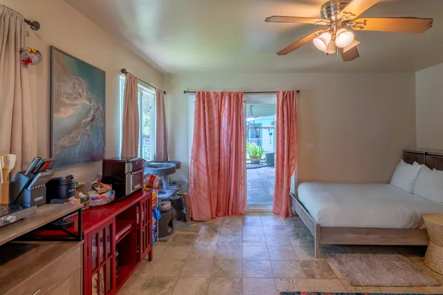 a bedroom with furniture and a bed