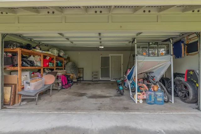 a view of a garage with a bike and a car