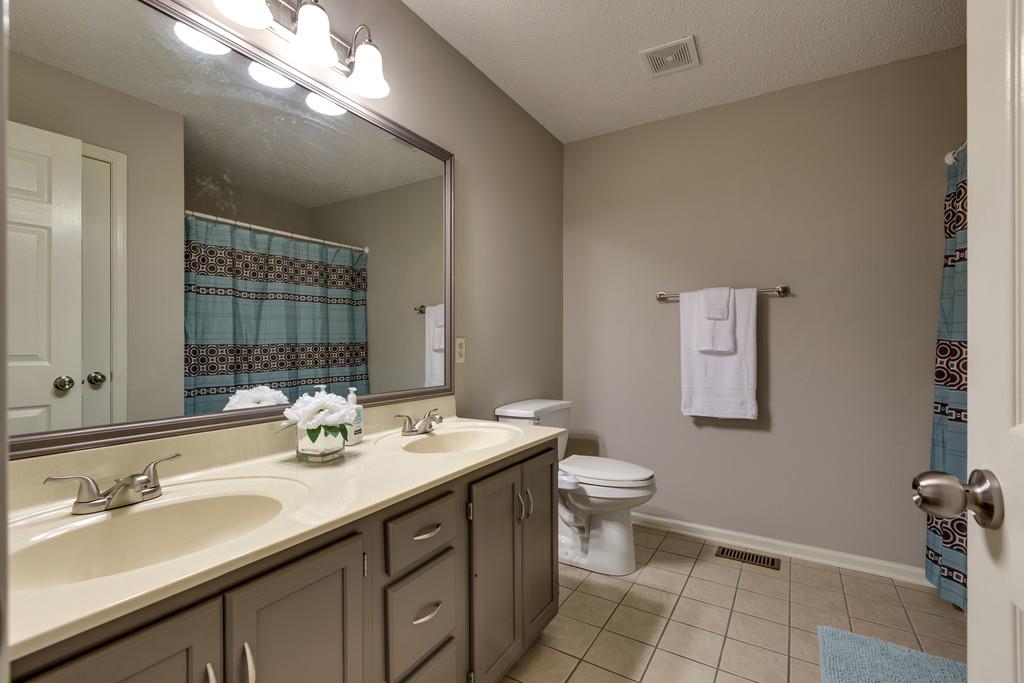2105 Zion Road Columbia, TN 38401 - Photo 19 of 29 2nd bathroom, extra large, beautiful gray cabinetry, and large linen closet.