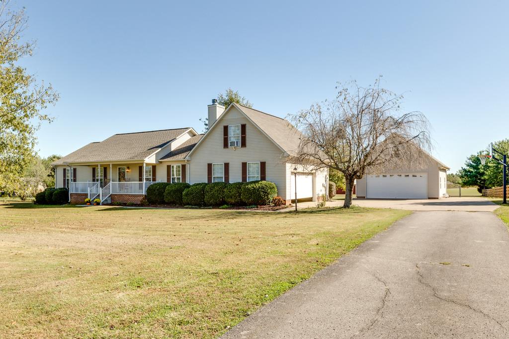 2105 Zion Road Columbia, TN 38401 - Photo 2 of 29 An enormous lot with a view of the attached garage and the detached garage.