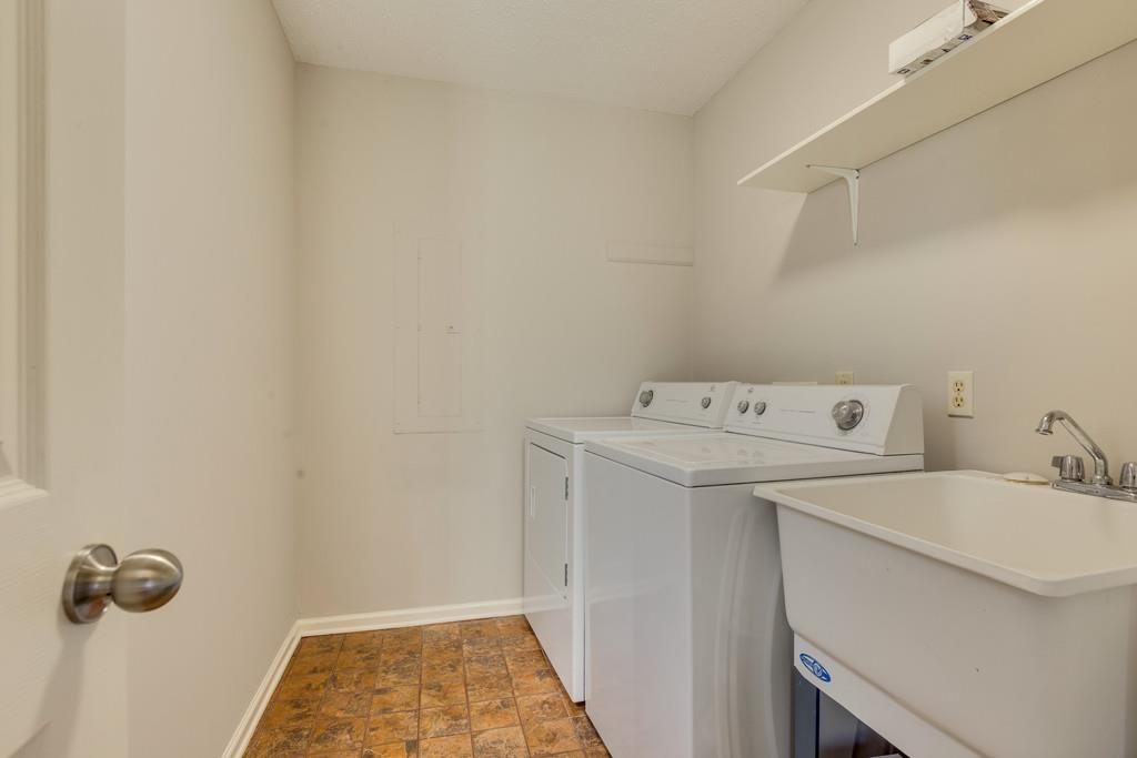 2105 Zion Road Columbia, TN 38401 - Photo 22 of 29 Spacious utility room with sink that is conveniently located off kitchen and garage and outside entries.