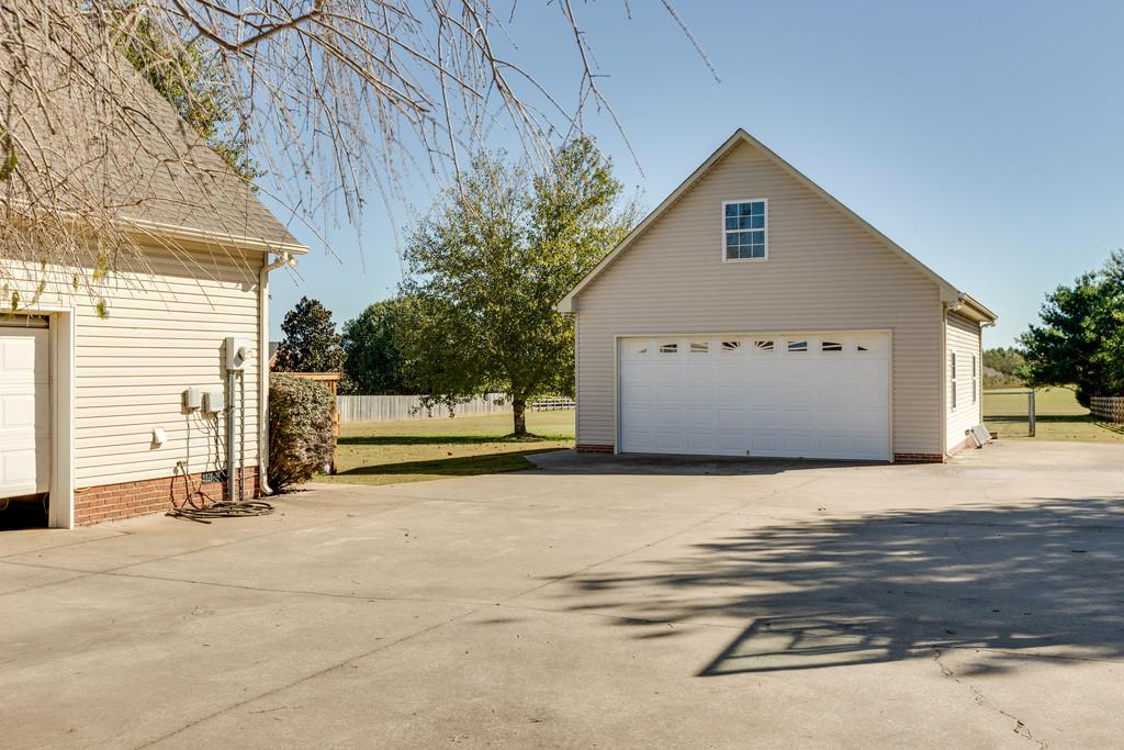 2105 Zion Road Columbia, TN 38401 - Photo 27 of 29 View of the detached double garage that is deep enough for all your outdoor equipment or toys. It has a work bench, upstairs storage and would make a great MAN CAVE!