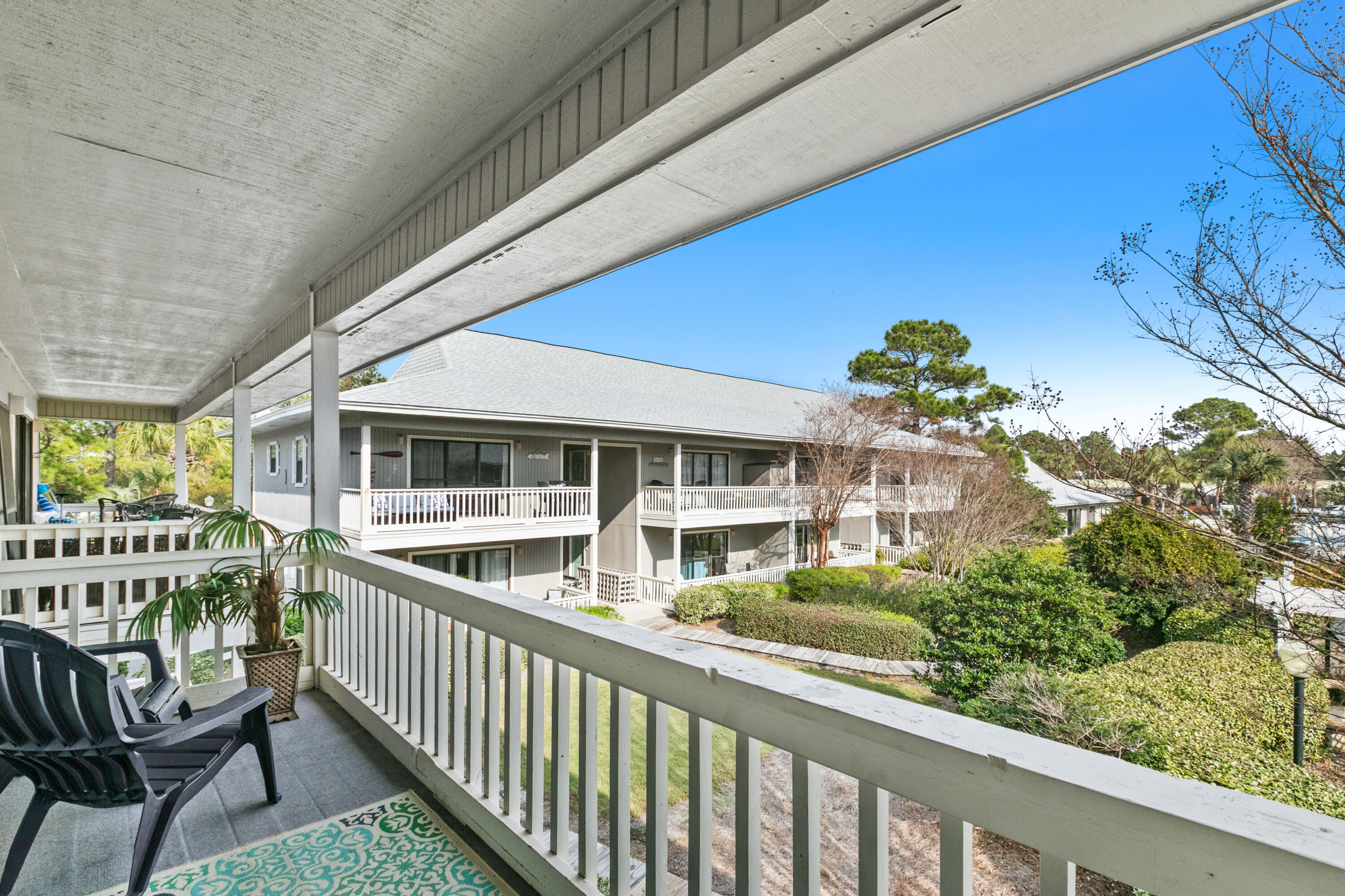 3799 East County Highway 30A, Unit F2 Santa Rosa Beach, FL 32459 - Photo 3 of 21 a view of a chair and tables in the balcony
