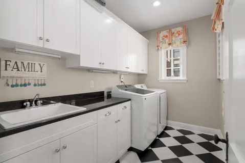 a kitchen with a sink and cabinets