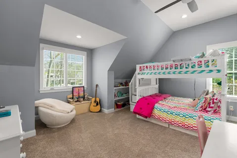 a bedroom with bed and a window