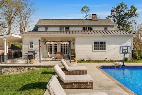 front view of a house with a swimming pool