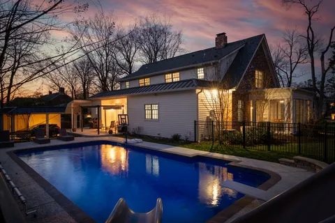 a view of swimming pool with patio