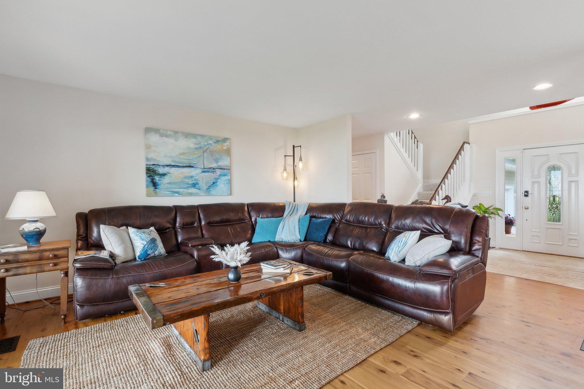 2921 Cox Neck Road East Chester, MD 21619 - Photo 30 of 66 a living room with furniture and a wooden floor