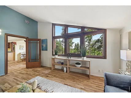 a living room with furniture window and wooden floor
