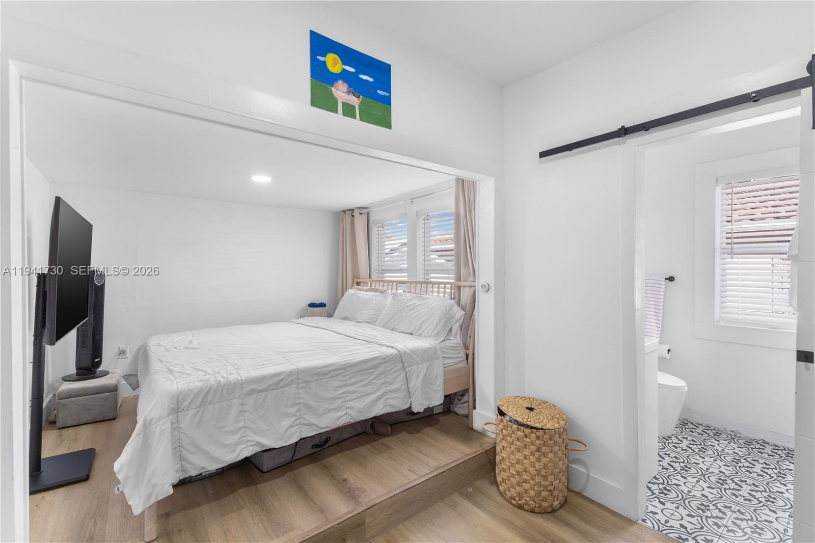 2811 Southwest 17th Street Miami, FL 33145 - Photo 19 of 36 a bedroom with a bed and a couch