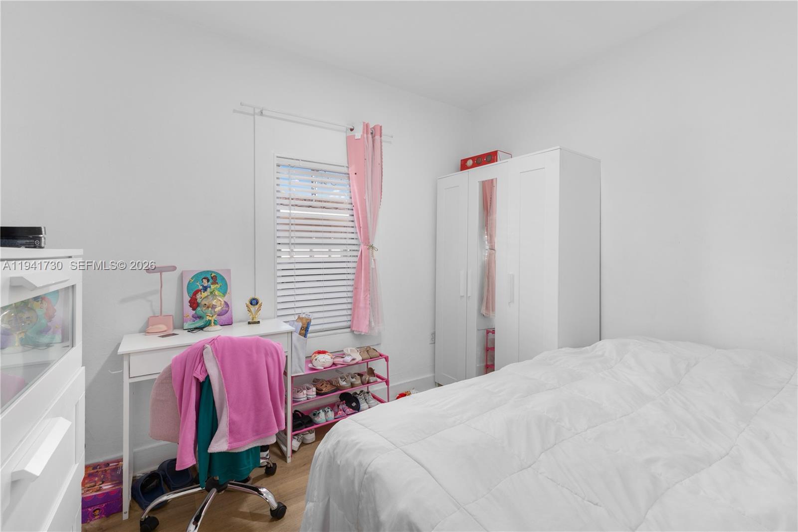 2811 Southwest 17th Street Miami, FL 33145 - Photo 22 of 36 a bedroom with a bed and a window