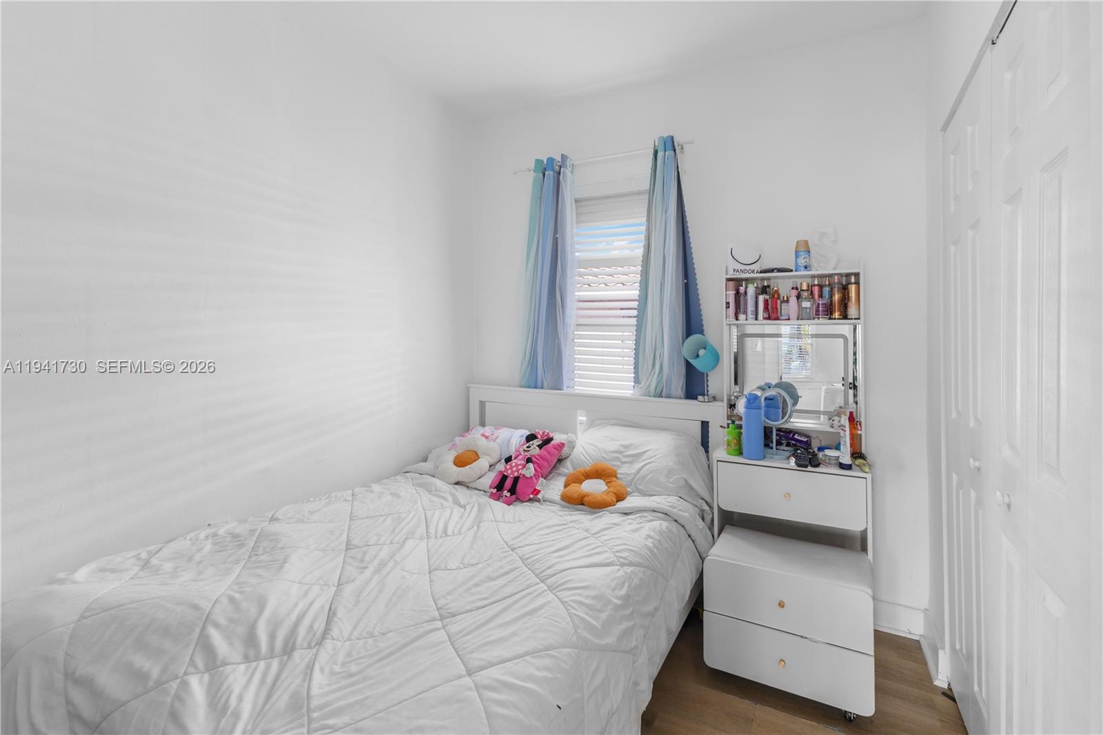 2811 Southwest 17th Street Miami, FL 33145 - Photo 23 of 36 a bedroom with a bed and a window