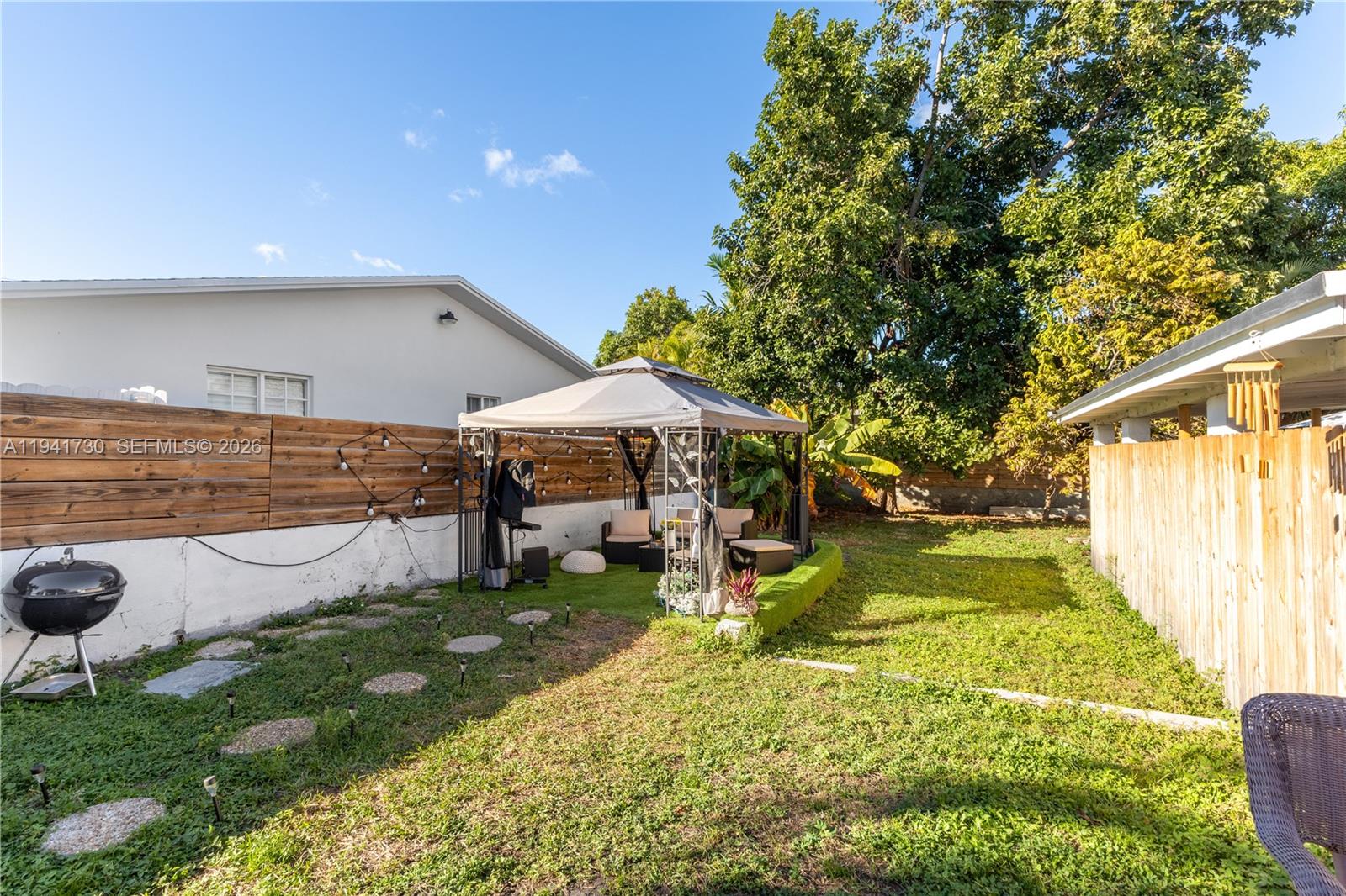 2811 Southwest 17th Street Miami, FL 33145 - Photo 24 of 36 a view of an chairs and tables in the patio