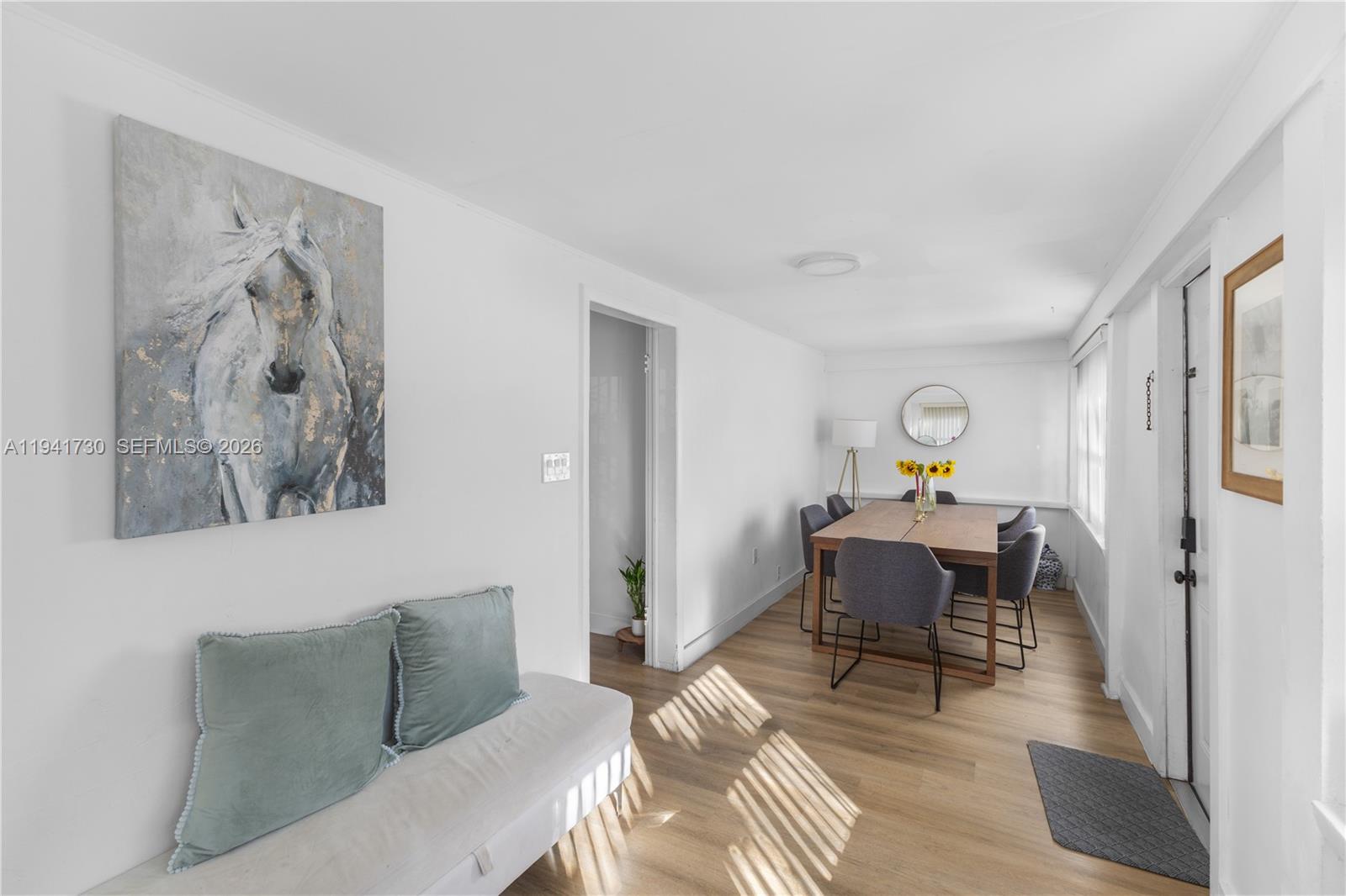 2811 Southwest 17th Street Miami, FL 33145 - Photo 8 of 36 a living room with furniture and a wooden floor