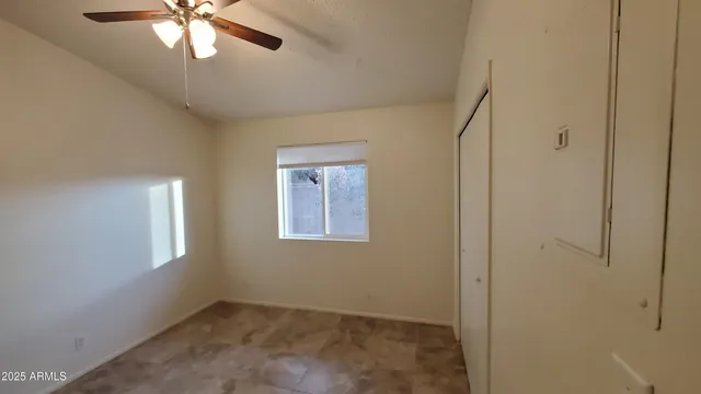 a view of a livingroom with a chandelier fan