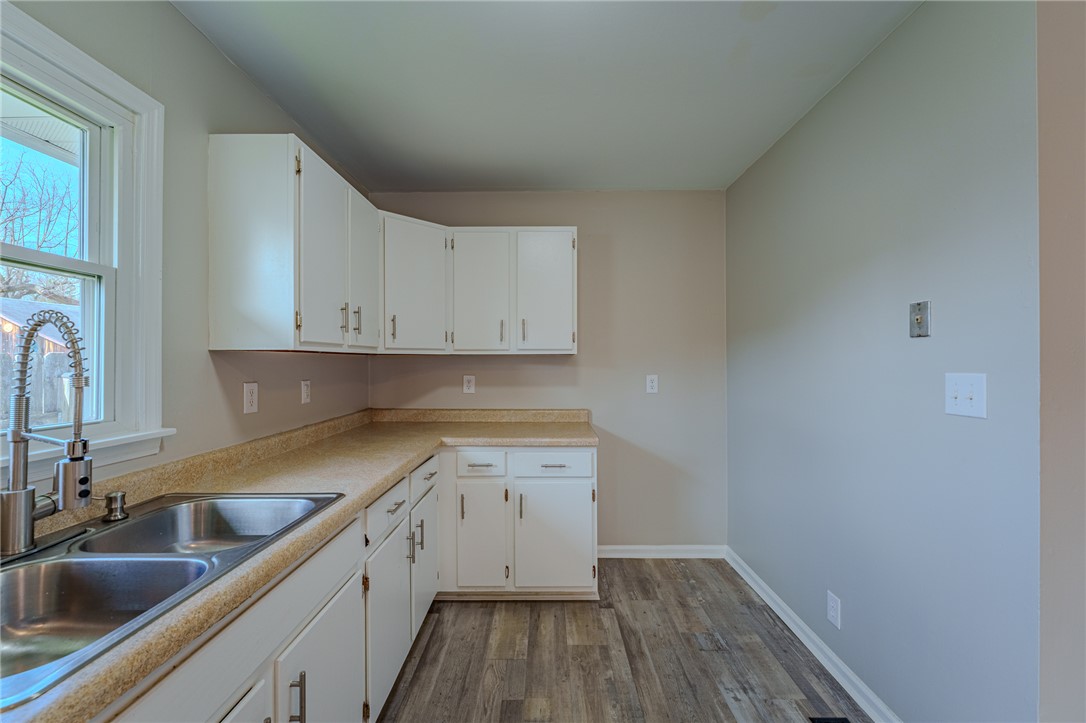 1005 Burt Street Springfield, OH 45505 - Photo 14 of 33 This functional kitchen features ample cabinetry and a bright window, ready for your culinary endeavors.