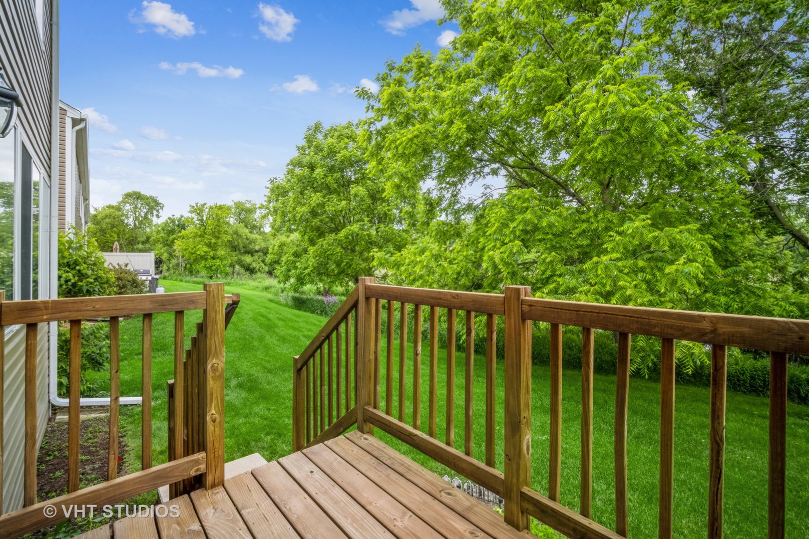 417 Locksley Drive Streamwood, IL 60107 - Photo 6 of 25 a balcony with trees in front of it