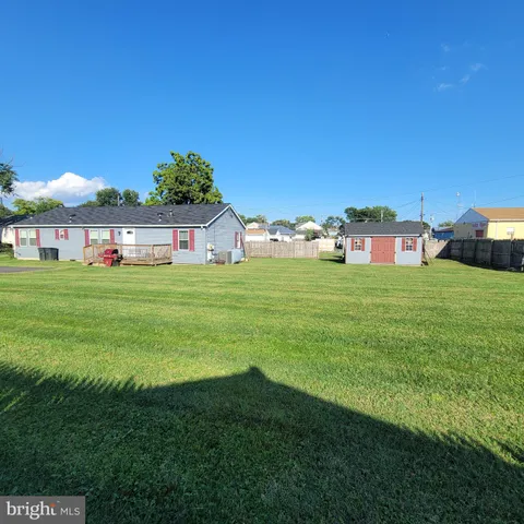 a view of a house with a big yard