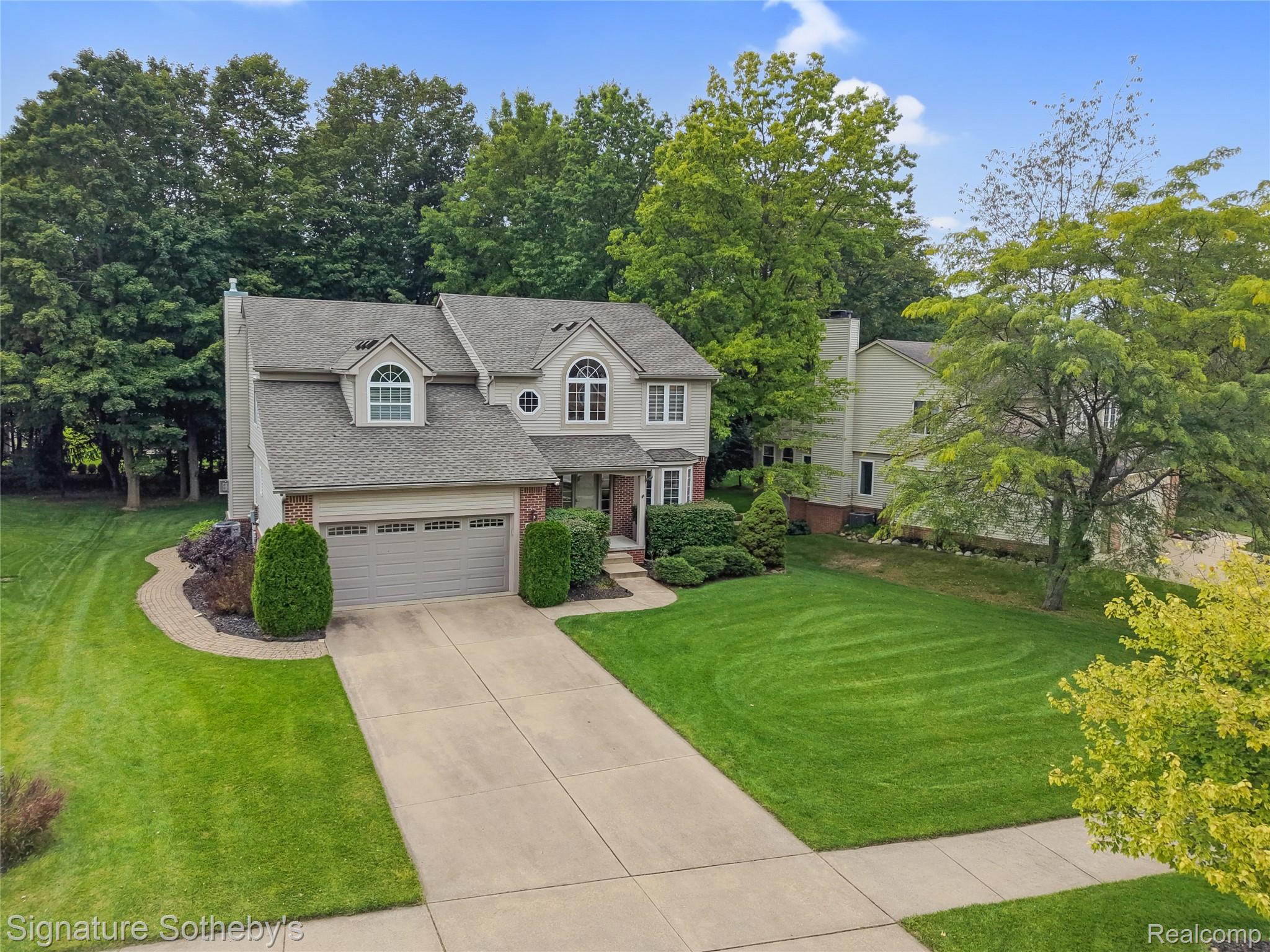 170 Fairhill Way Howell, MI 48843 - Photo 42 of 60 Front elevation featuring mature trees