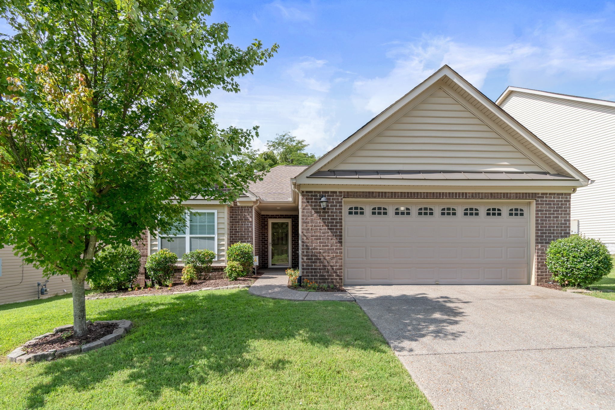 6045 Cane Springs Road Antioch, TN 37013 - Photo 1 of 23 a front view of house with a garden and plants