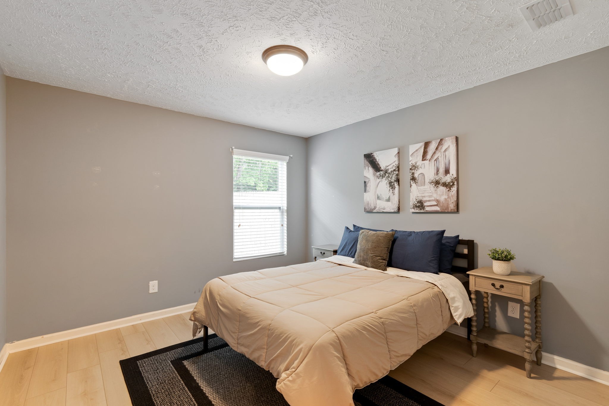 6045 Cane Springs Road Antioch, TN 37013 - Photo 14 of 23 a bedroom with a large bed and a window