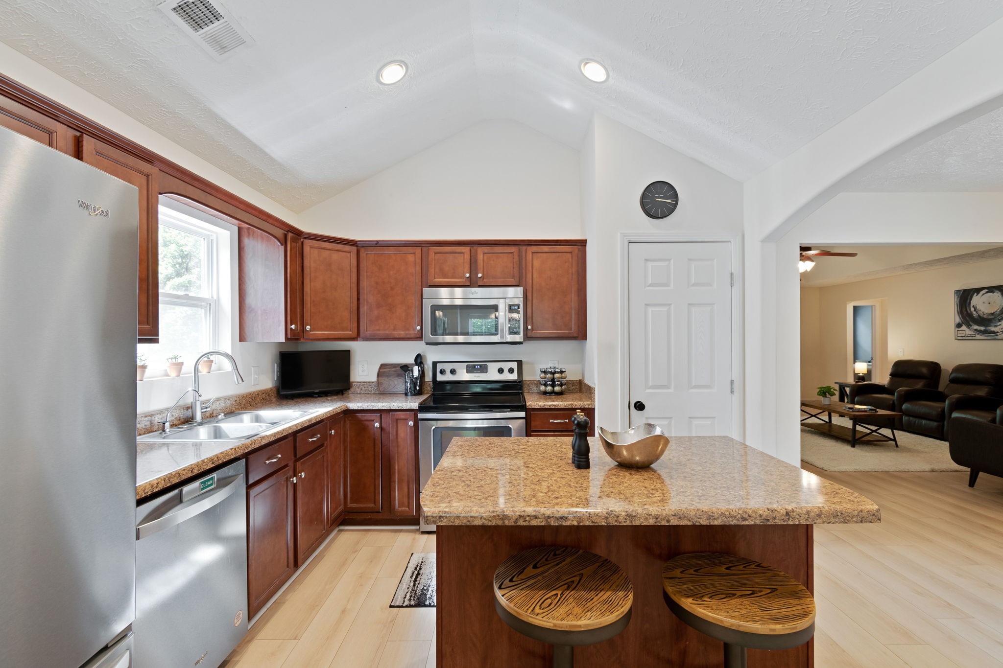 6045 Cane Springs Road Antioch, TN 37013 - Photo 3 of 23 a kitchen with stainless steel appliances granite countertop a stove a sink and a refrigerator