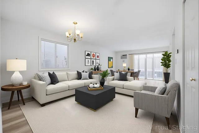 a living room with furniture a chandelier fan and a window