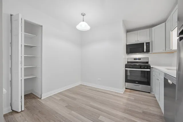 a view of kitchen and wooden floor