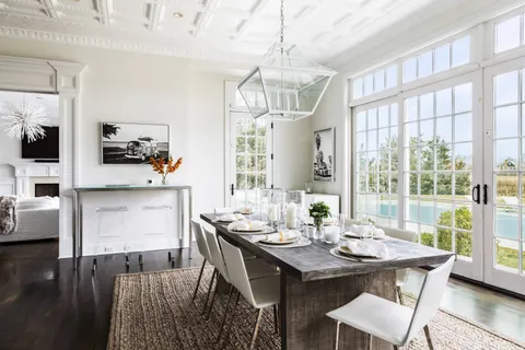 a view of a dining room with furniture window and wooden floor