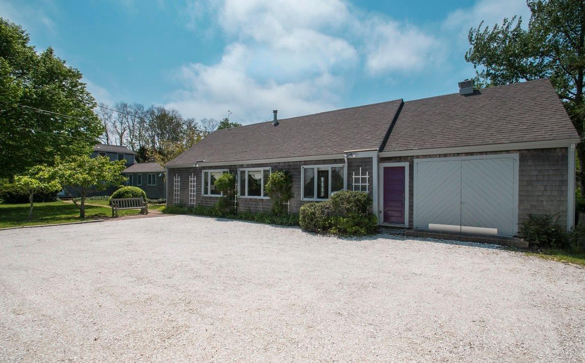 545 Old Harbor Road Chatham, MA 02633 - Photo 11 of 35 a front view of a house with a garden