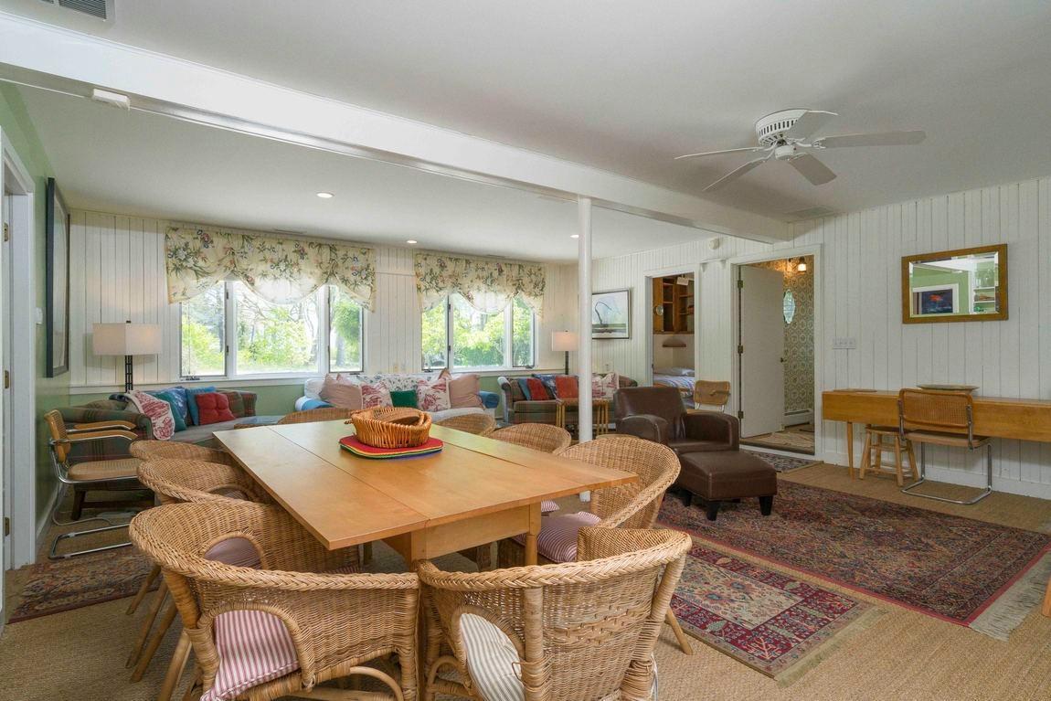 545 Old Harbor Road Chatham, MA 02633 - Photo 17 of 35 a view of a dining room with furniture