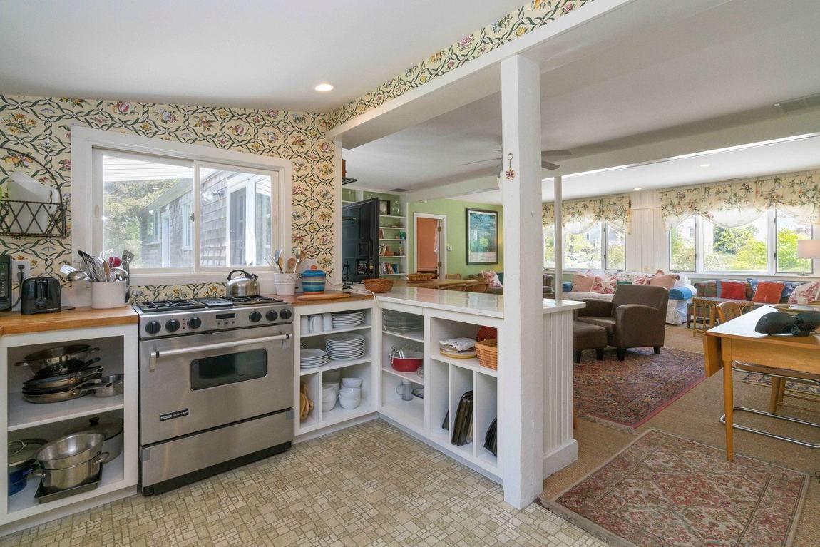 545 Old Harbor Road Chatham, MA 02633 - Photo 19 of 35 a kitchen with a stove and a view of living room