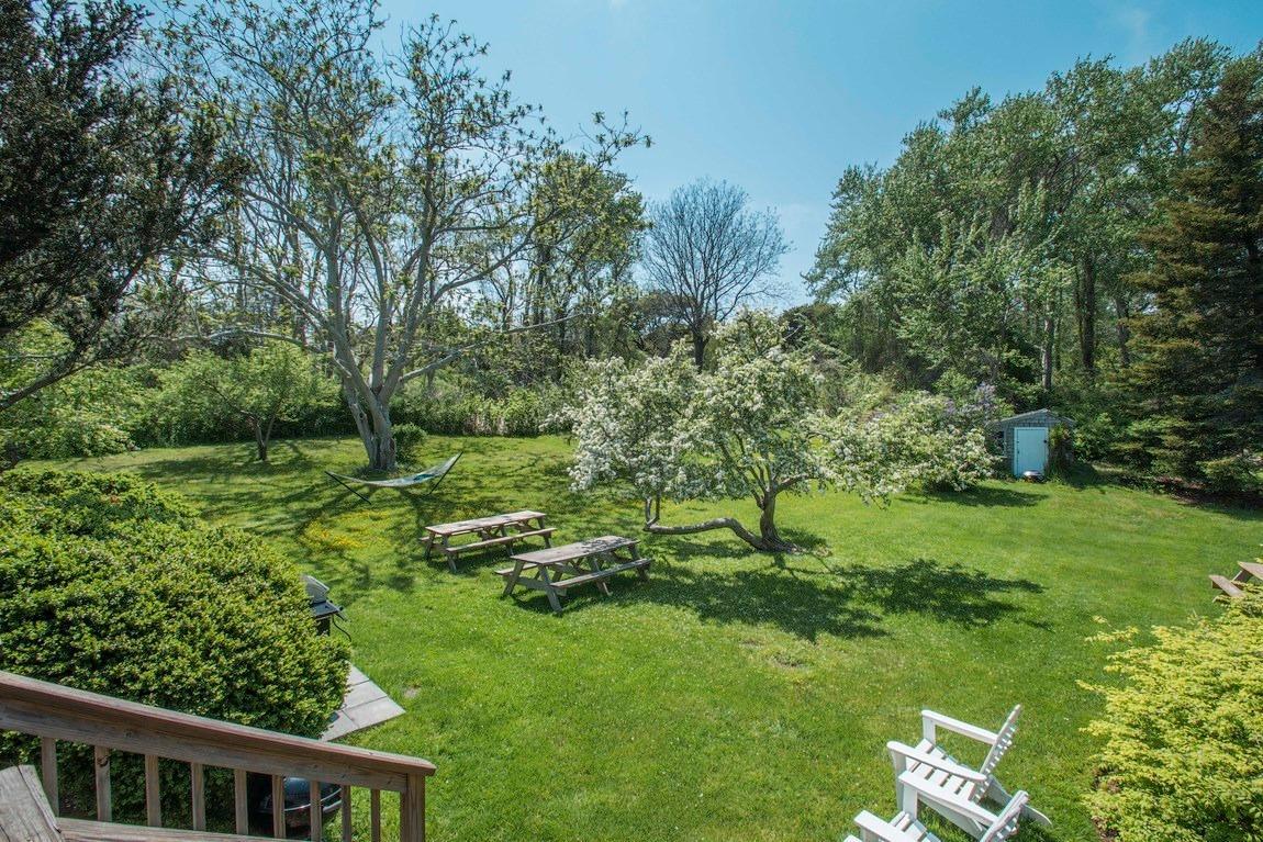 545 Old Harbor Road Chatham, MA 02633 - Photo 2 of 35 a view of yard with green space