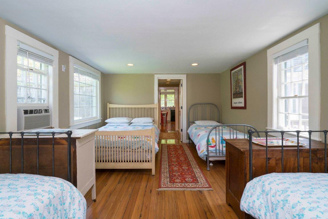 545 Old Harbor Road Chatham, MA 02633 - Photo 30 of 35 a bedroom with a bed and a window