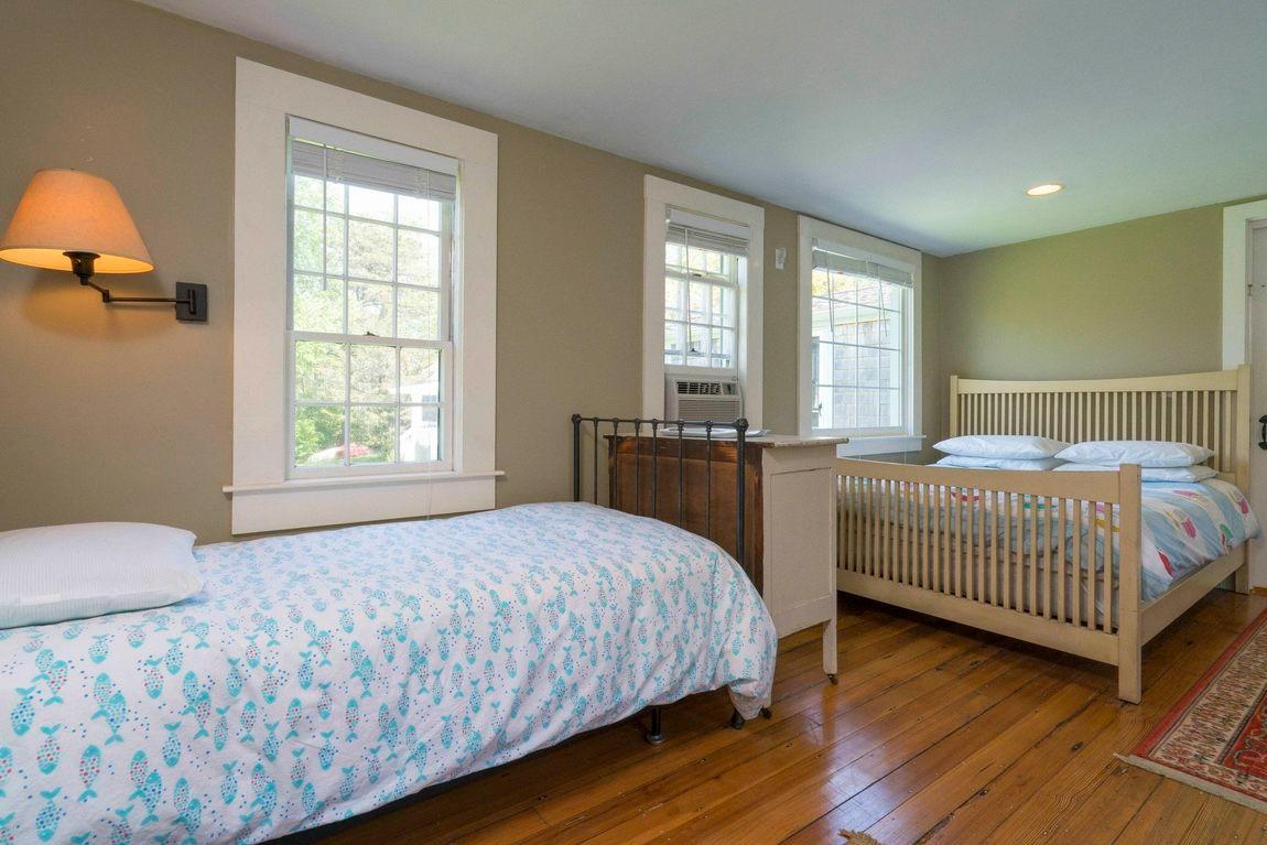 545 Old Harbor Road Chatham, MA 02633 - Photo 33 of 35 a bedroom with a bed and a window