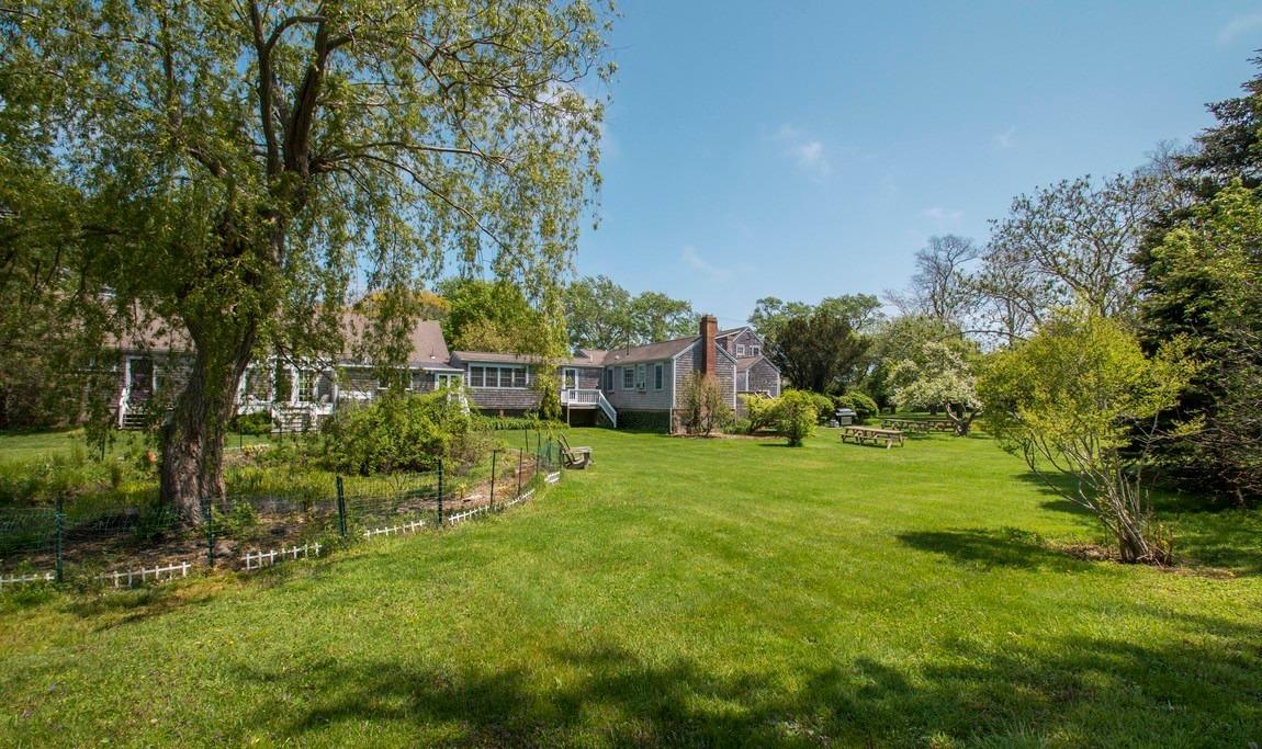 545 Old Harbor Road Chatham, MA 02633 - Photo 35 of 35 a view of a big yard with plants and large trees