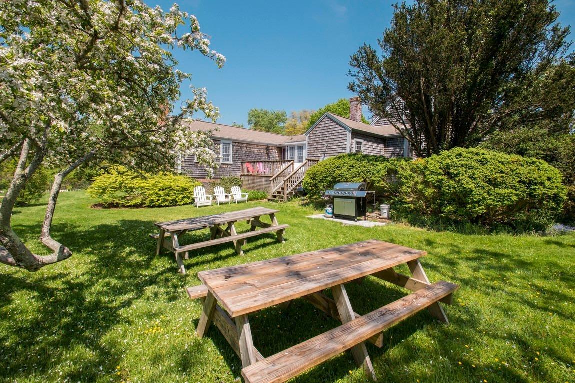 545 Old Harbor Road Chatham, MA 02633 - Photo 10 of 35 a view of a house with backyard porch and furniture
