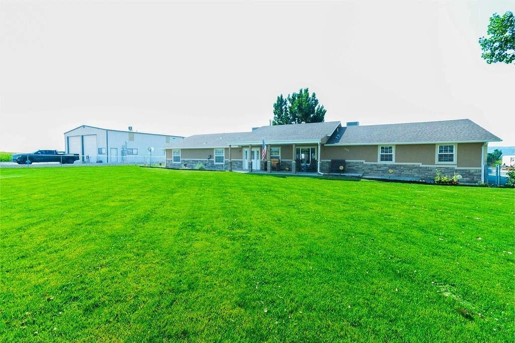 1329 Q Road Loma, CO 81524 - Photo 1 of 1 a view of a house with a yard and sitting area