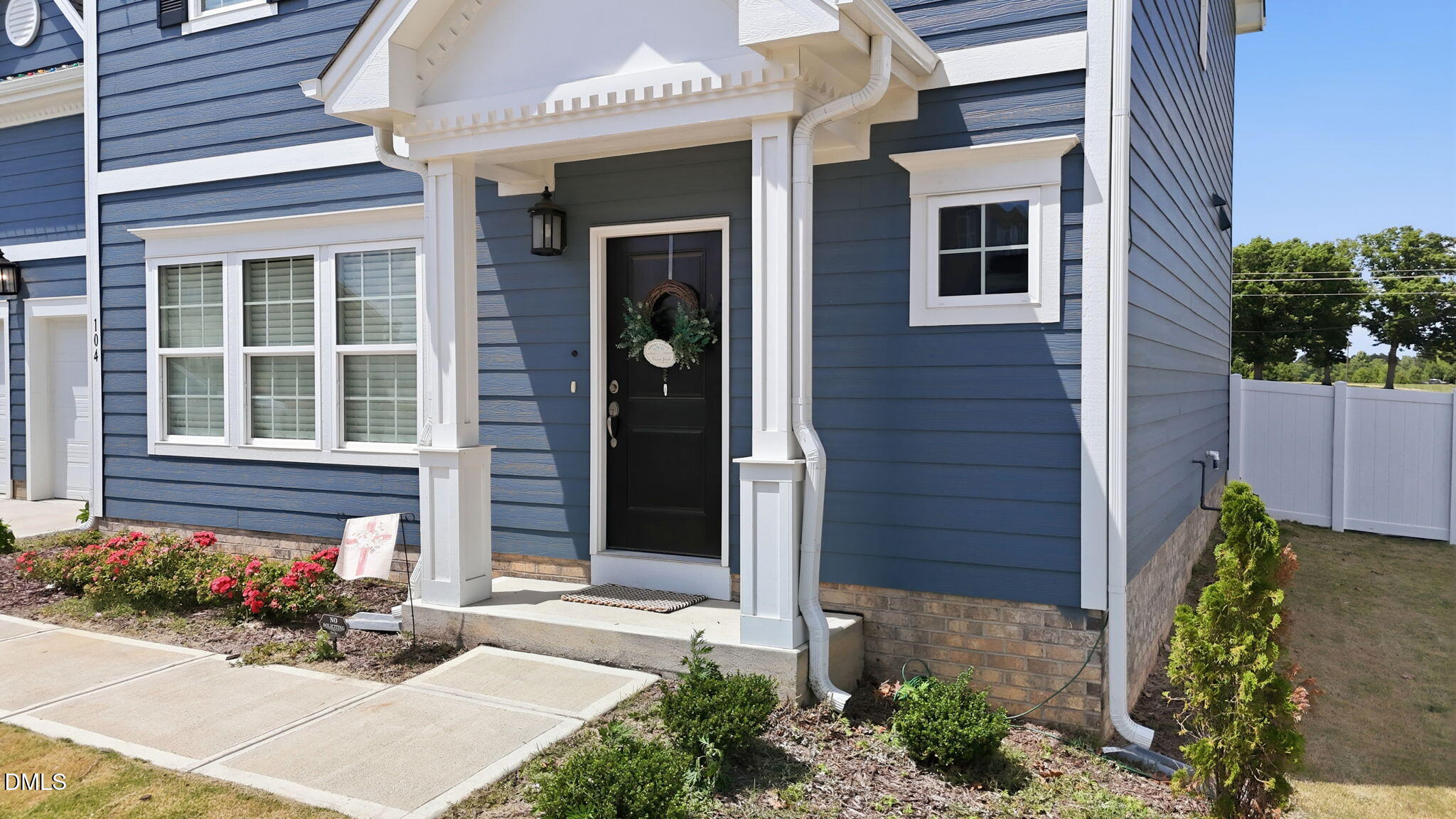 104 Kavanaugh Road Wake Forest, NC 27587 - Photo 5 of 36 a front view of a house with a garden