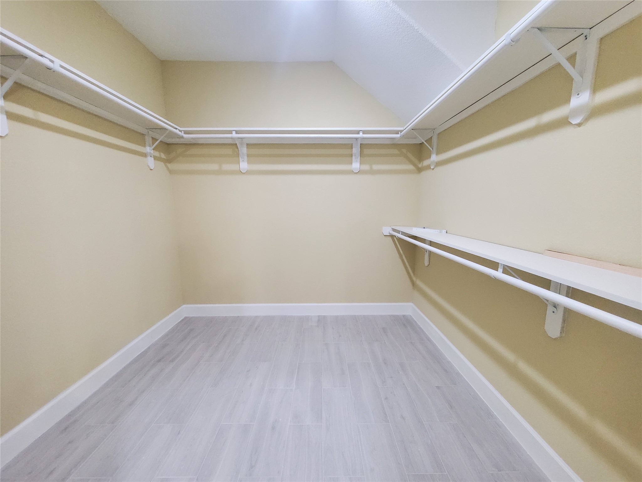 1306 North 9th Street Conroe, TX 77301 - Photo 33 of 47 a view of an empty walk in closet