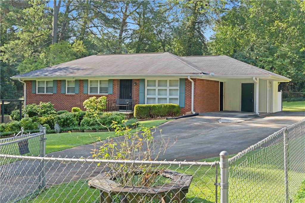 4267 Welbron Drive Decatur, GA 30035 - Photo 1 of 1 a front view of a house with garden