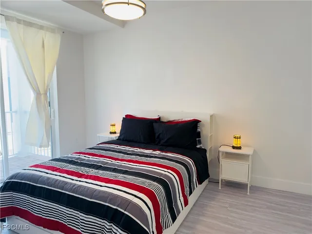 a spacious bathroom with a sink a toilet a shower and a mirror