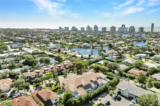 an aerial view of residential houses with city view