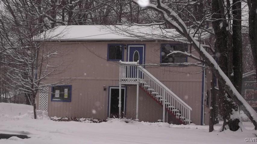 1623 Cotswald Road Tobyhanna, PA 18466 - Photo 1 of 14 a house with trees in front of it