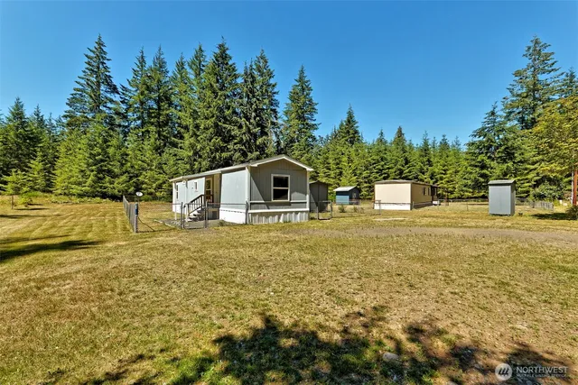 a backyard of a house with lots of green space